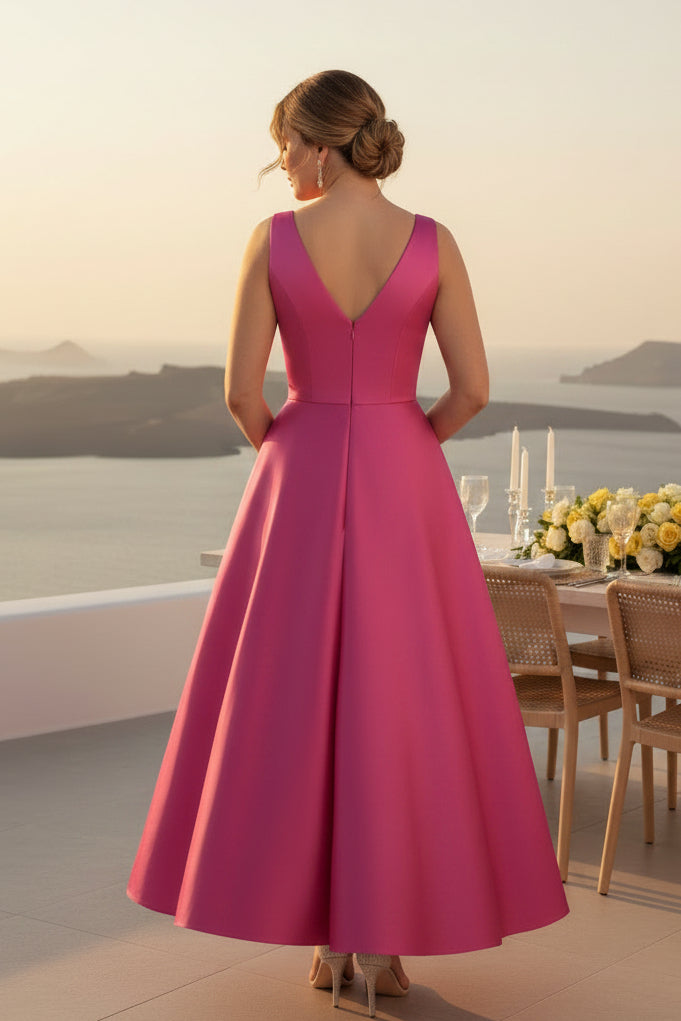 Vestido midi de satén acampanado con cuello en V, lazo y bolsillos