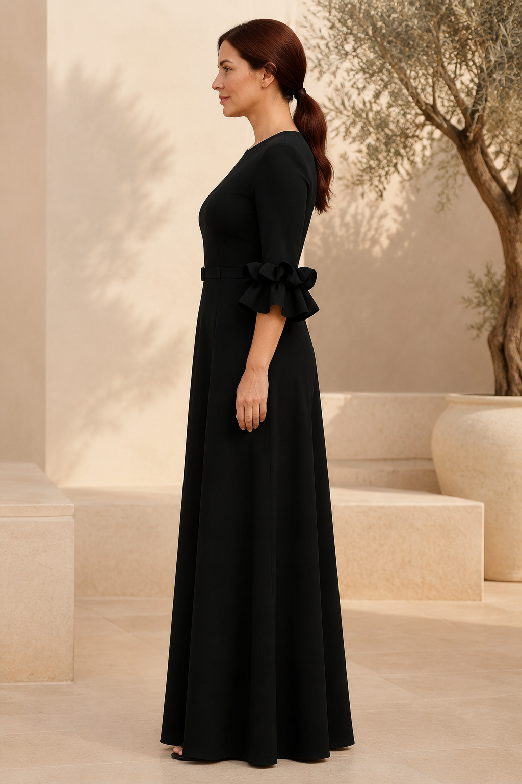 Vestido maxi acampanado con cinturón y mangas con puños con volantes