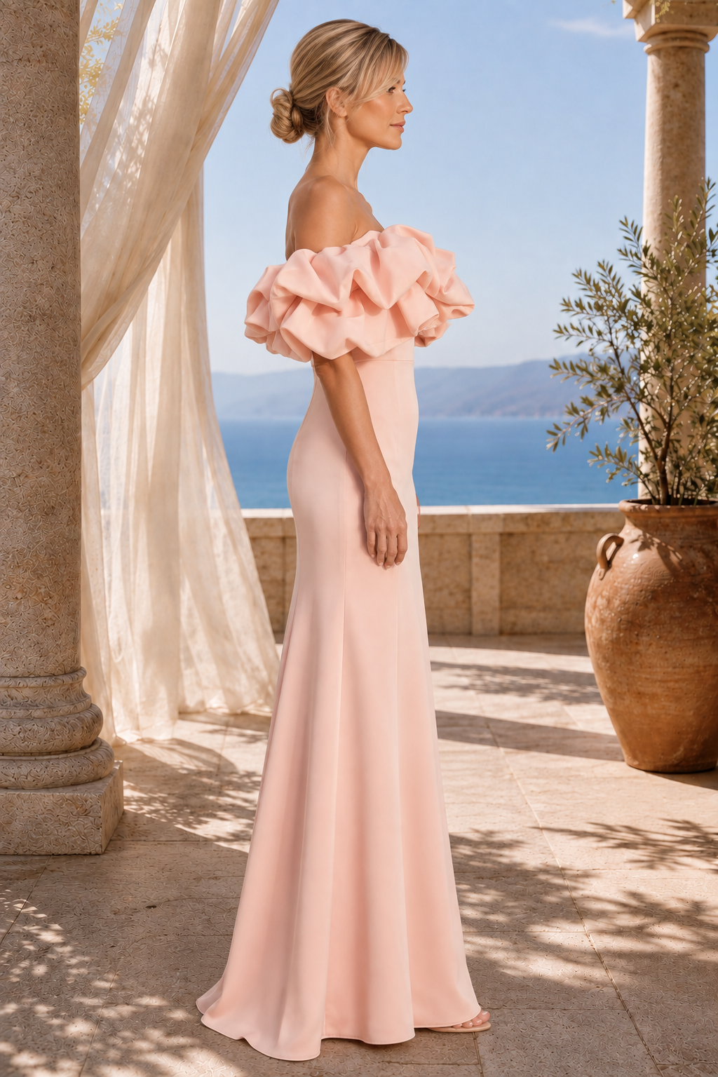 Vestido de noche con hombros descubiertos, volantes y corte sirena