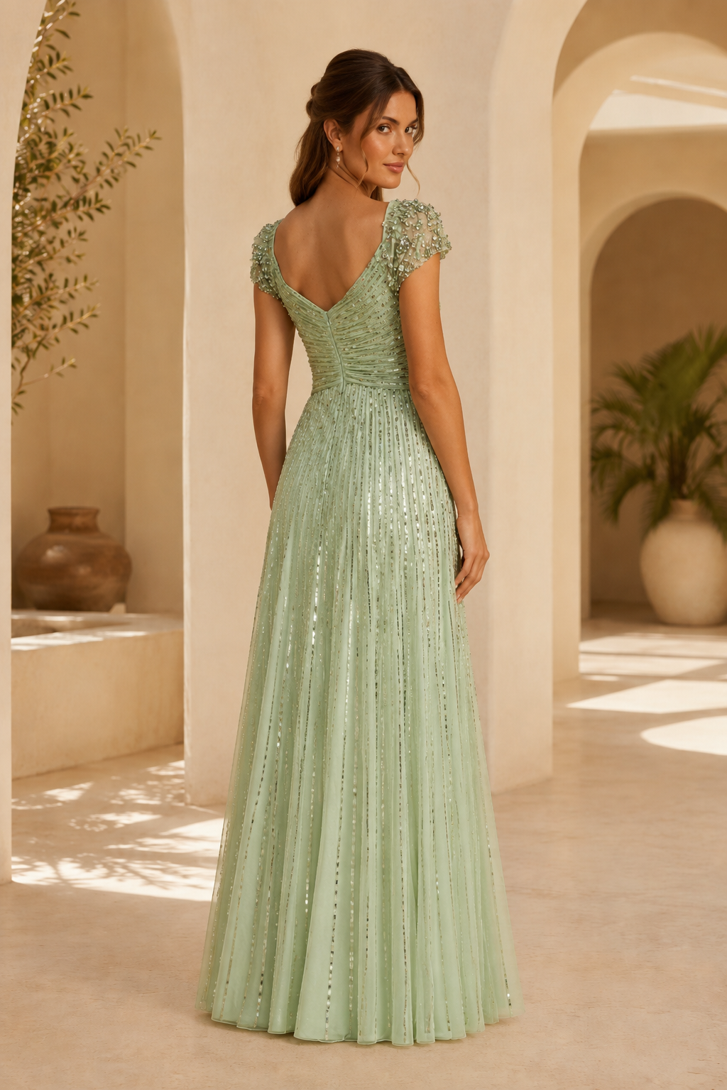 Vestido de noche acampanado de lentejuelas con mangas casquillo de cuentas